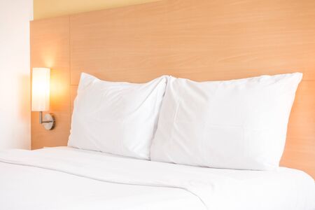 White pillow on bed decoration in bedroom interior