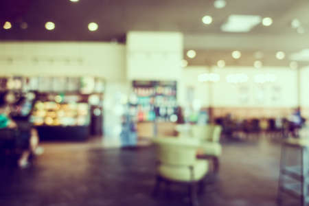 Abstract blur luxury coffee shop cafe interior for backgroundの写真素材
