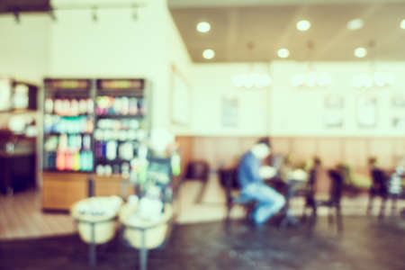 Abstract blur luxury coffee shop cafe interior for backgroundの写真素材