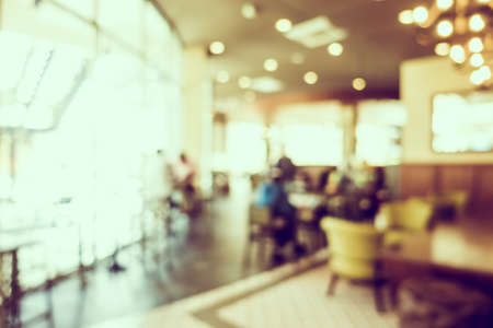 Abstract blur luxury coffee shop cafe interior for backgroundの写真素材