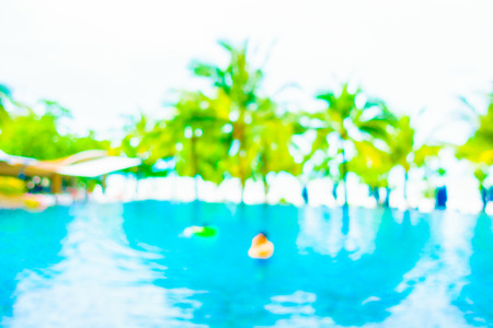 Abstract blur outdoor swimming pool with beach and sea for backgroundの写真素材