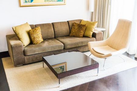 Beautiful pillow on sofa decoration in living room interior