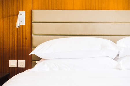 White pillow on bed decoration in bedroom interior - Vintage light Filter