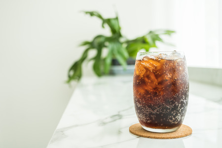 Selective focus point Iced cola glass in restaurantの写真素材