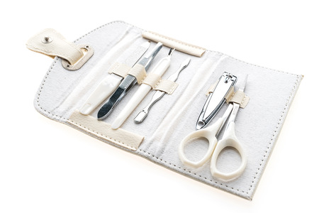 Fingernail and manicure set in leather bag isolated on white backgroundの写真素材