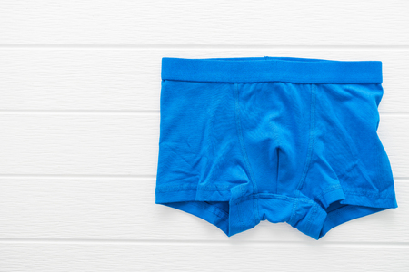 Underwear or Underpants and clothing for men on white wooden backgroundの写真素材