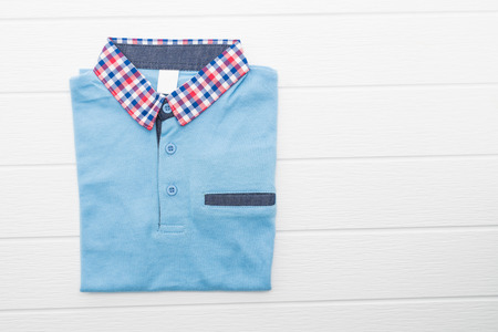 Shirt and Clothes on white wooden backgroundの写真素材