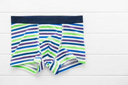 Underwear or Underpants and clothing for men on white wooden backgroundの写真素材