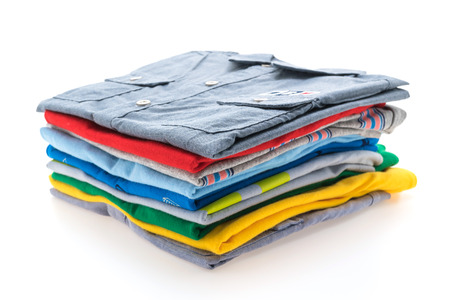 Colorful Stack of T Shirt and Polo isolated on white background