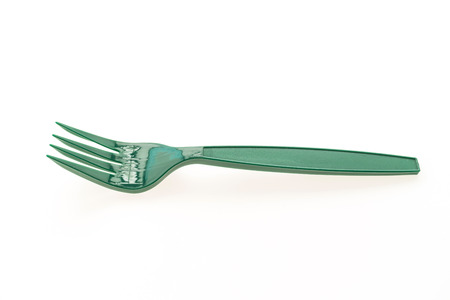 Green plastic forks isolated on white backgroundの写真素材