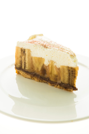 Banana banoffee pie and cake in white plate isolated on white backgroundの写真素材