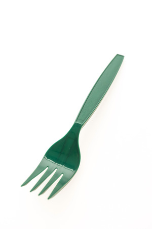 Green plastic forks isolated on white backgroundの写真素材