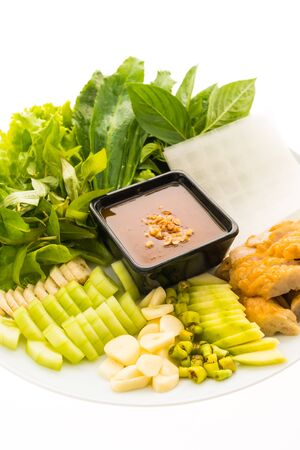 Vietnamese Pork Sausage and salad OR Nam-Neaung in white plate isolated on white backgroundの写真素材
