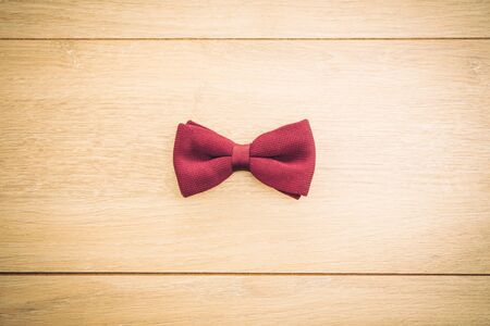 Bow and tie on wooden background - Vintage Filterの写真素材