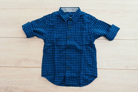 Beautiful men fashion shirt for clothing on wooden background - Vintage Filter Processingの写真素材