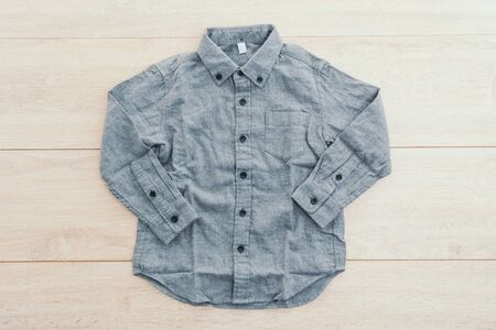 Beautiful men fashion shirt for clothing on wooden background - Vintage Filter Processingの写真素材