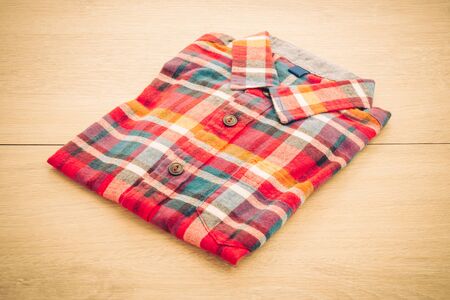 Beautiful men fashion shirt for clothing on wooden background - Vintage Filter Processingの写真素材