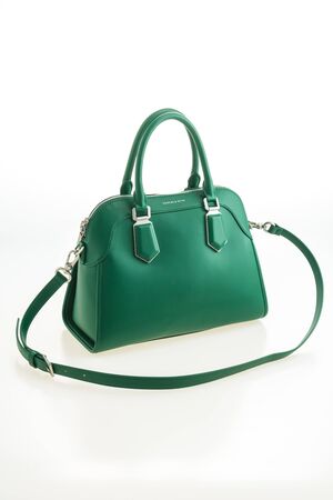 Beautiful elegance and luxury fashion leather green women handbag isolated on white backgroundの写真素材