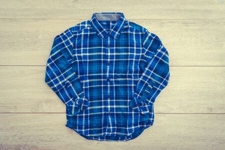 Beautiful men fashion shirt for clothing on wooden background - Vintage Filter Processing