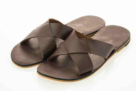 Men leather sandal and flip flop shoes isolated on white backgroundの写真素材