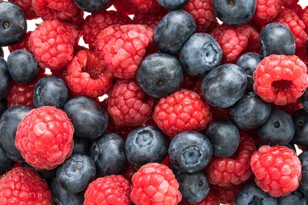 Group of Blueberry and Rasberry fruit isolated on white backgroundの写真素材
