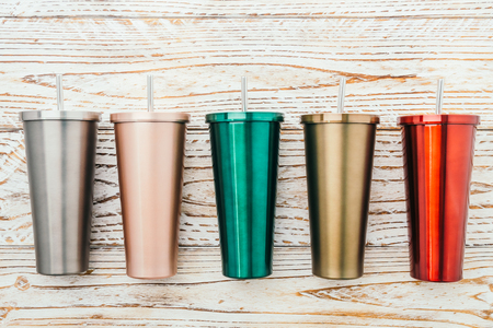 Stainless and tumbler cup on wooden backgroundの写真素材