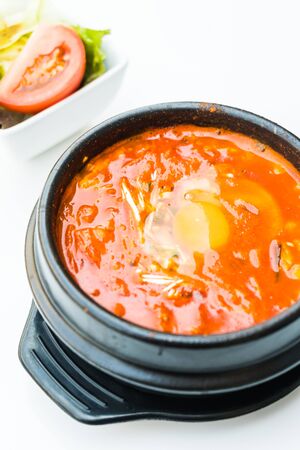 Korea spicy soup in black bowlの写真素材