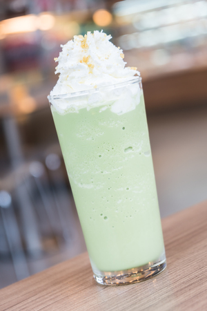 Iced green tea smoothie on tableの写真素材