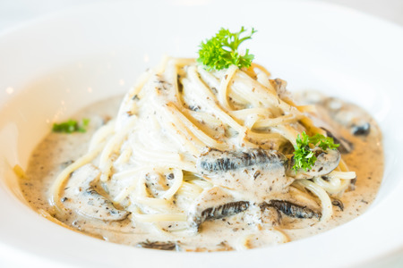 Selective focus point on Spaghetti cream sauce with truffle mushroom in white plate - Italian food stlyeの写真素材