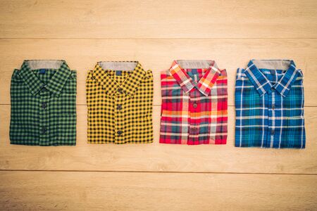 Beautiful men fashion shirt for clothing on wooden background - Vintage Filter Processingの写真素材