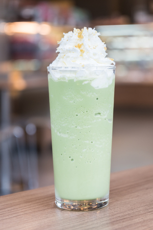 Iced green tea smoothie on tableの写真素材
