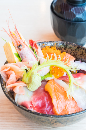 Japanese rice bowl with sashimi seafood on top - Selective focus pointの写真素材