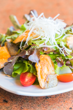 Fried salmon salad with vegetable in white plate - Healthy food styleの写真素材