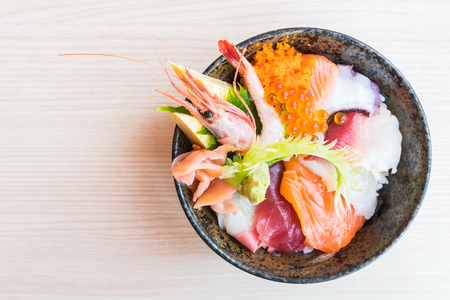 Japanese rice bowl with sashimi seafood on top - Selective focus pointの写真素材