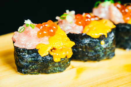 Uni sushi with otoro tuna and salmon egg on top - Japanese food styleの写真素材