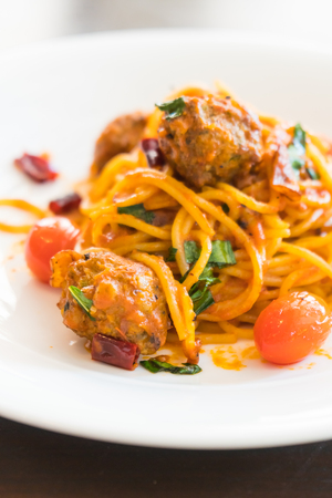 Selective focus point on Spaghetti meatballs with sauce in white plate - Italian food styleの写真素材