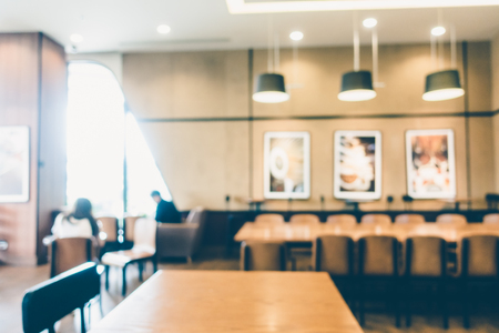 Abstract blur and defocused coffee shop cafe and restaurant interior for background - Vintage Filterの写真素材