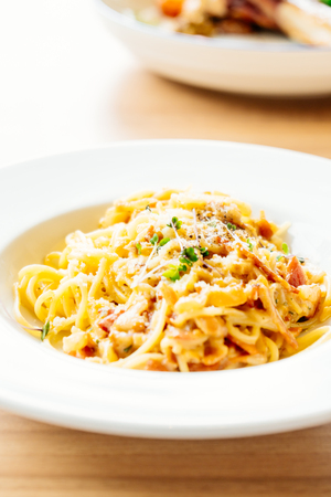 Spaghetti carbonara with ham in white plate - Italian food styleの写真素材