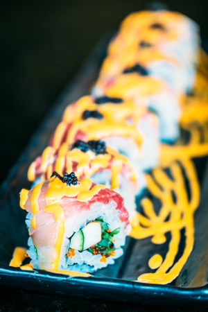 Selective focus point on Hamachi sushi japanese food style - Color filter Processingの写真素材