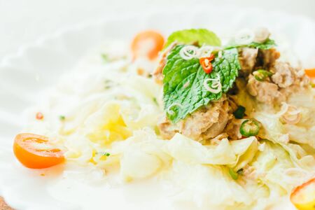 Tuna salad with fresh vegetable in white plate - Healthy food style
