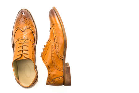 Brown leather shoes isolated on white backgroundの写真素材
