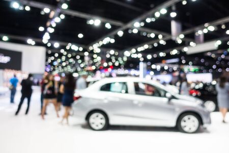 Abstract blur and defocused car and motor exhibition show interior for backgroundの写真素材