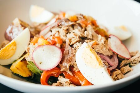 Tuna salad with egg in white bowl - Healthy food style