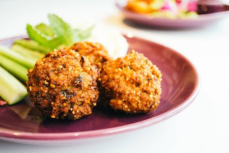 Spicy minced pork ball salad in plate - Thai food style , color filter Processingの写真素材