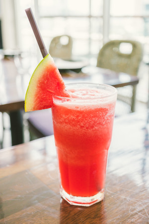 iced watermelon juice smoothies glass on table - Color filter Processingの写真素材