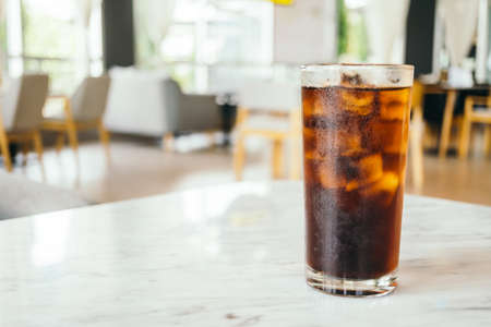 Iced cola drinking glass on tableの写真素材