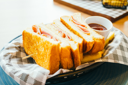 Sandwich with ham cheese and french fries and tomato sauce - Color Filter Processingの写真素材