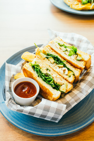 Sandwich with avocado and chicken meat with french fries and tomato sauce - Color Filter Processingの写真素材