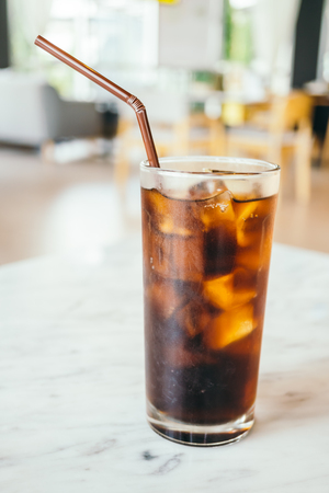 Iced cola drinking glass on tableの写真素材