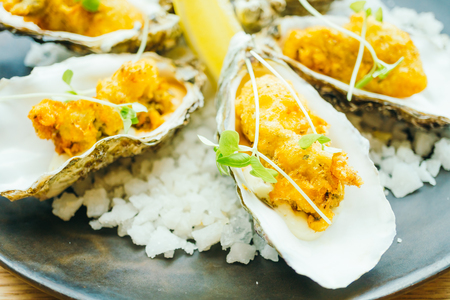 Fried oyster shell with sauce in plate - Color Filter Processingの写真素材